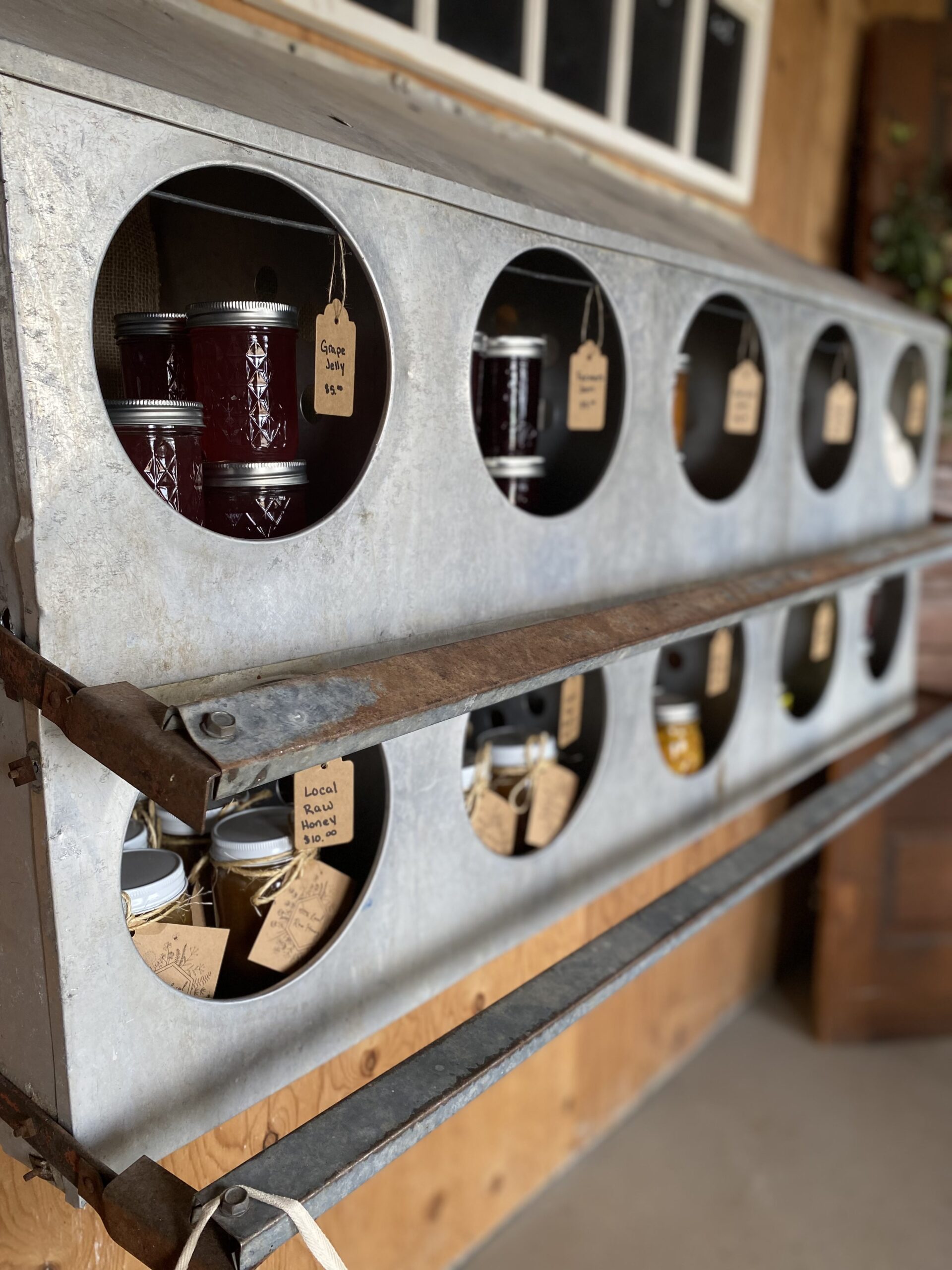 Assorted cheese platter featuring a variety of cheeses including Brie, Gouda, and blue cheese, accompanied by fresh red grapes and dried fruits, presented in a wooden tray. Ideal for cheese lovers and gourmet gatherings.